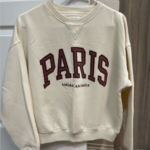 American Eagle Outfitters Cream Crewneck Sweater with Paris Design